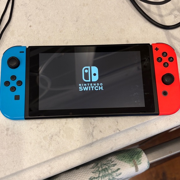 Nintendo Switch Console with Vibrant Red and Blue Controllers - Picture 7 of 8